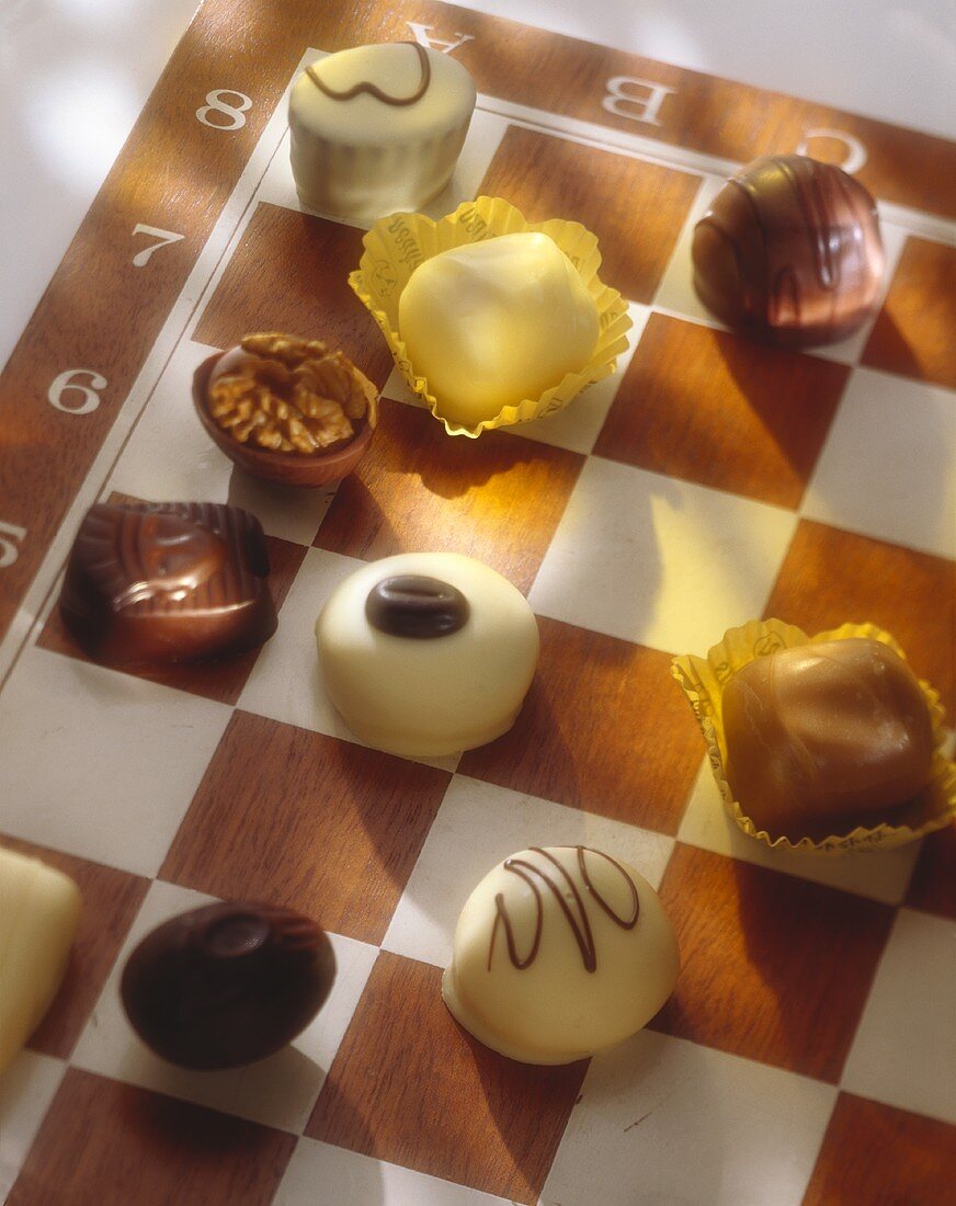 Assorted chocolates on a chess board