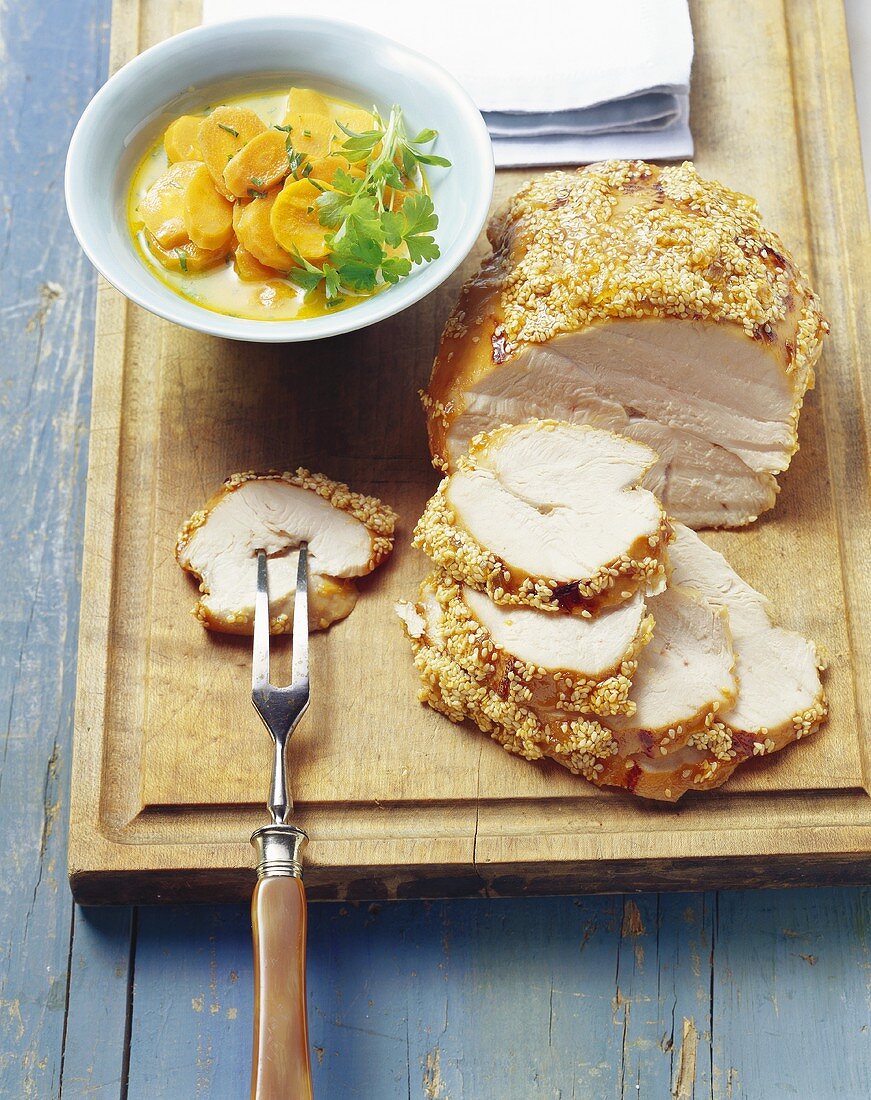 Roast pork with honey sesame crust and carrots