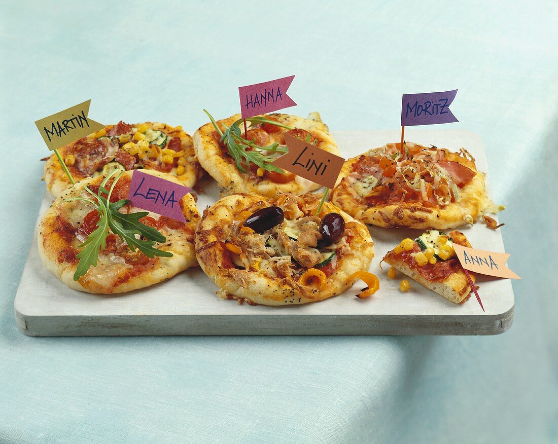 Pizzas with name flags for children