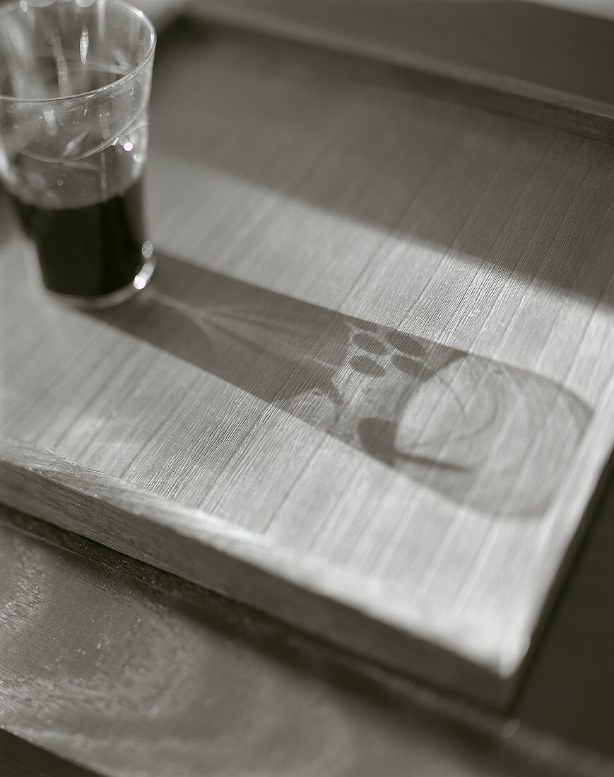 Glass of red wine with shadow