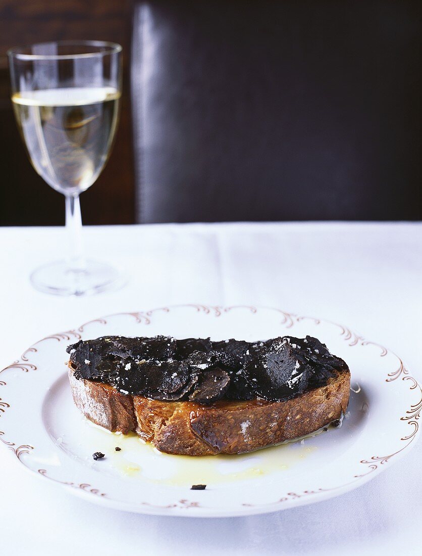 Bread topped with black truffles