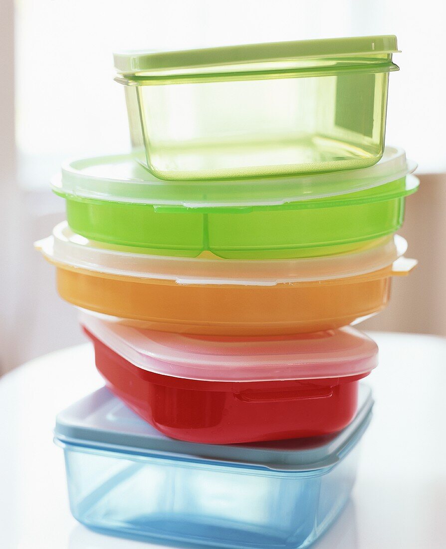 Various food storage containers in a pile