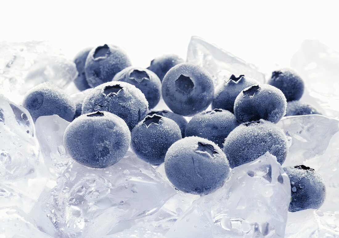 Frozen blueberries on ice cubes
