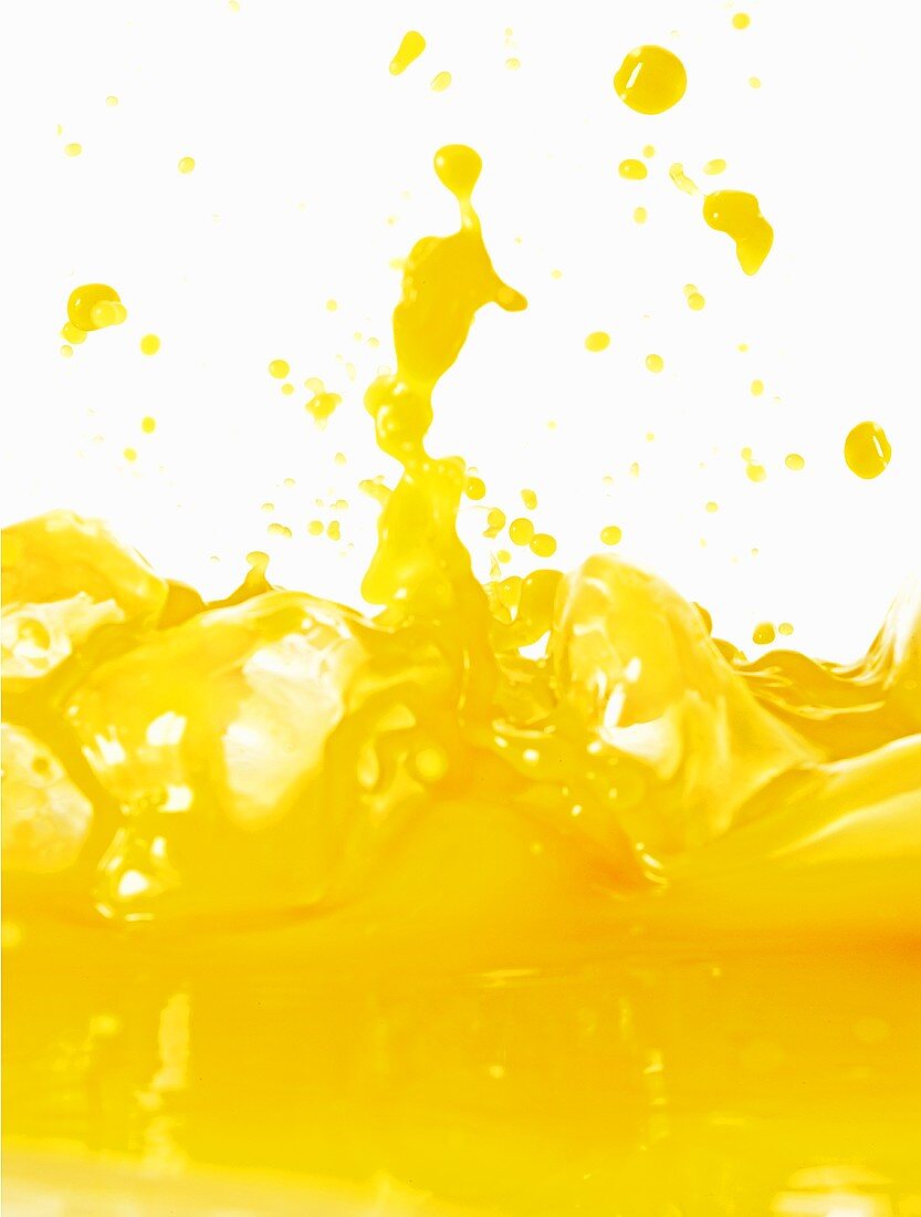 Splashing orange juice (close-up)