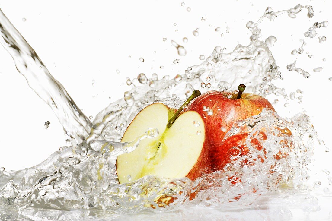 Fresh apples in a jet of water