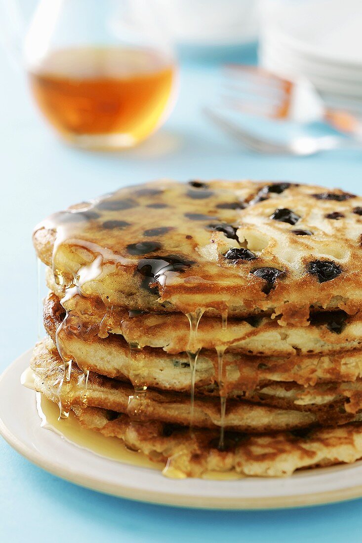 Pile of pancakes with maple syrup
