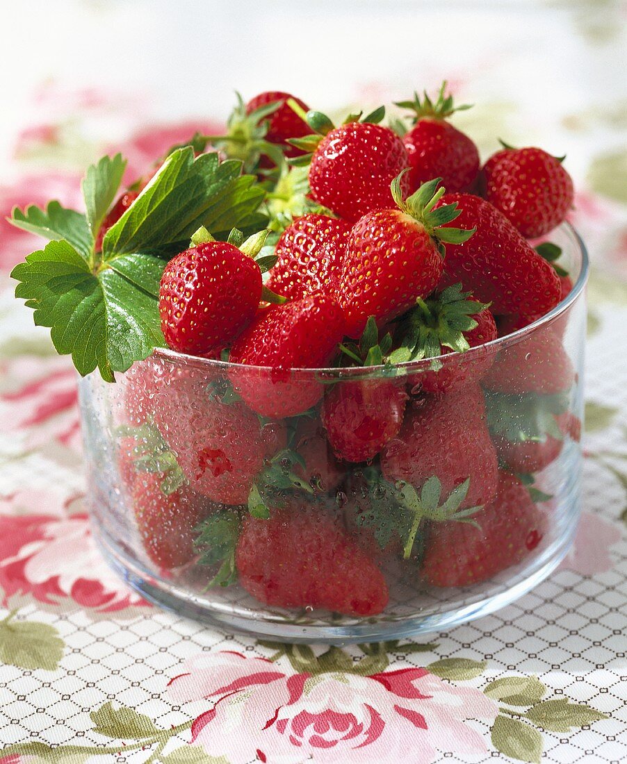 Fresh strawberries in a glass bowl