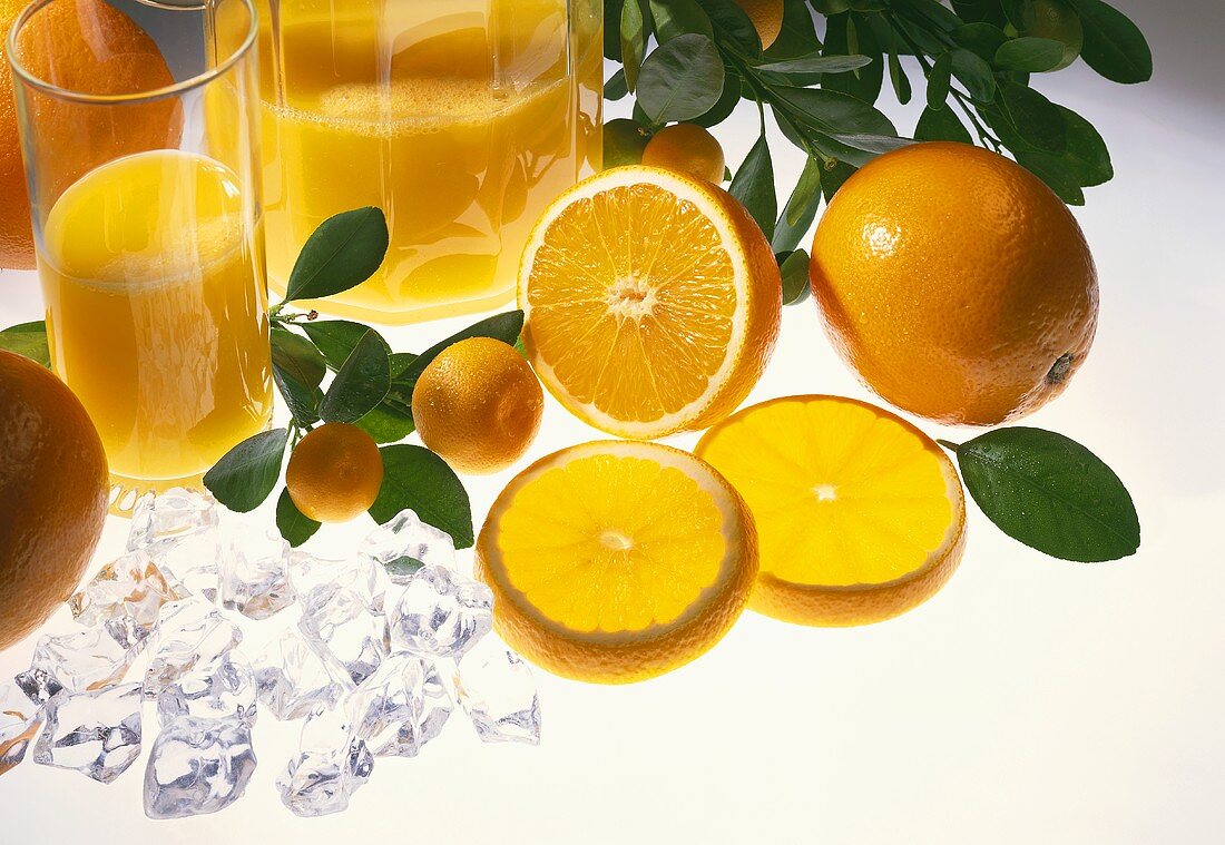 Orange juice with oranges and ice cubes