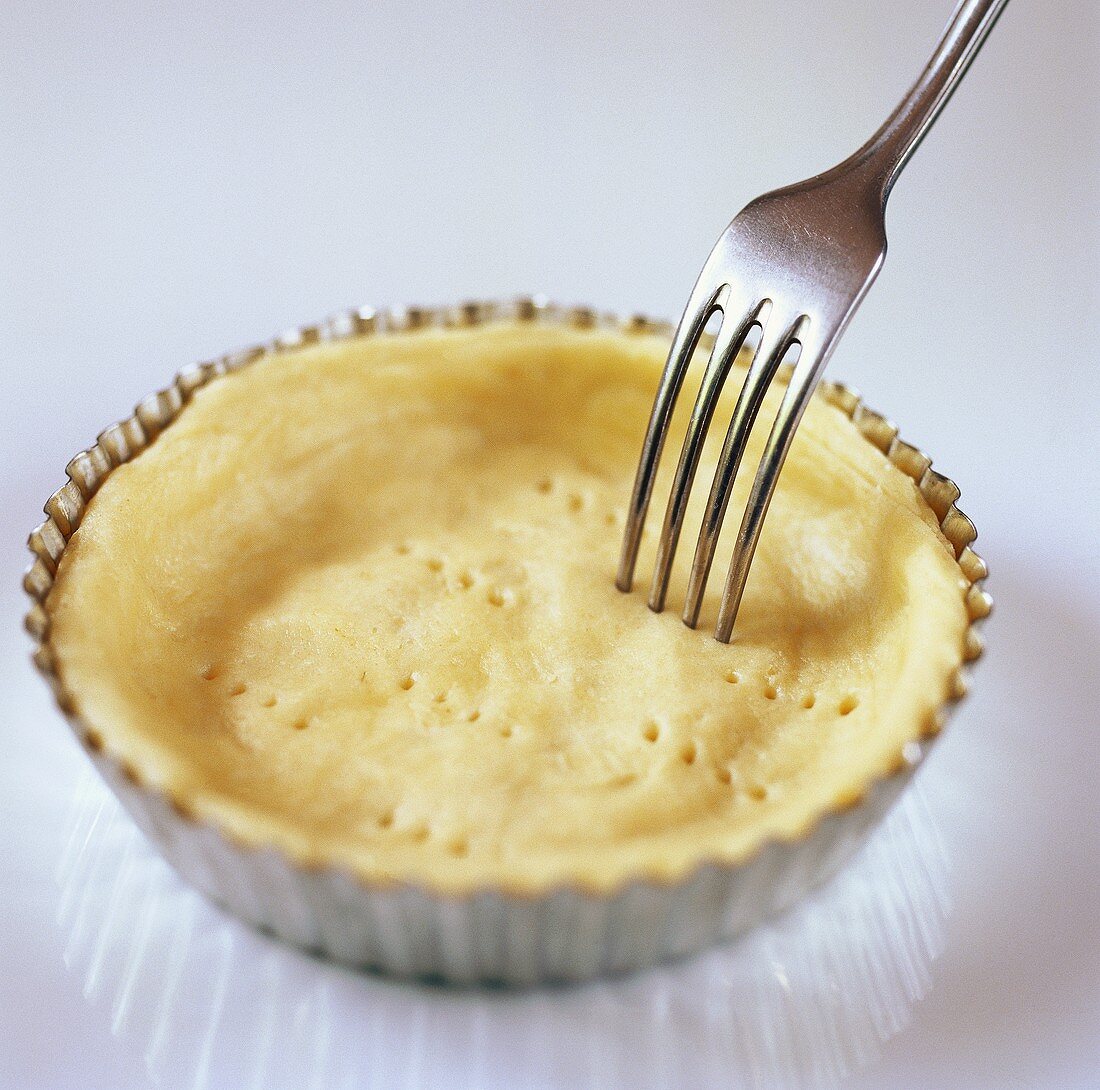 Pricking tart base with a fork