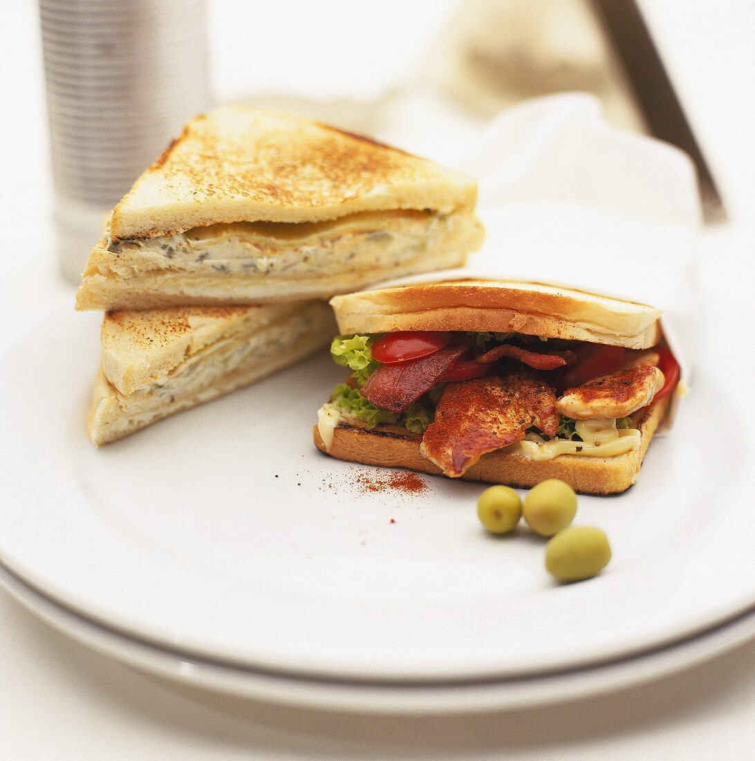 Club sandwich with chicken and sandwich with olive mayonnaise