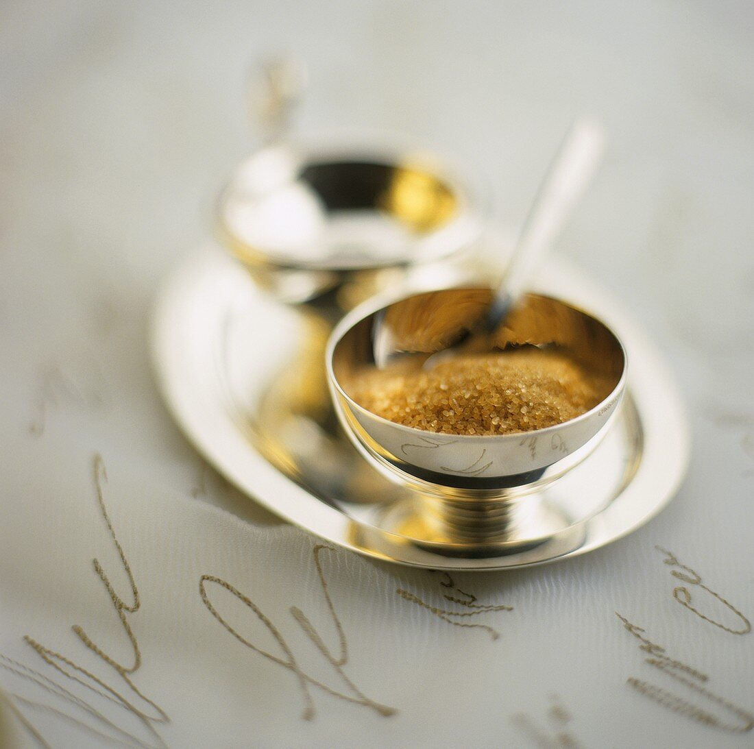 Brown sugar in silver bowl