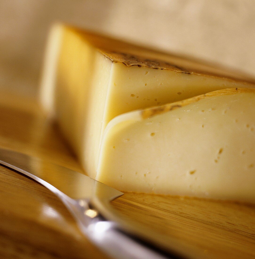 Raclette cheese with knife