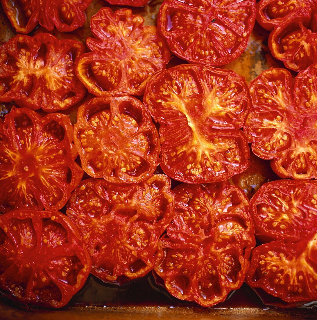 Oven-baked tomatoes in olive oil