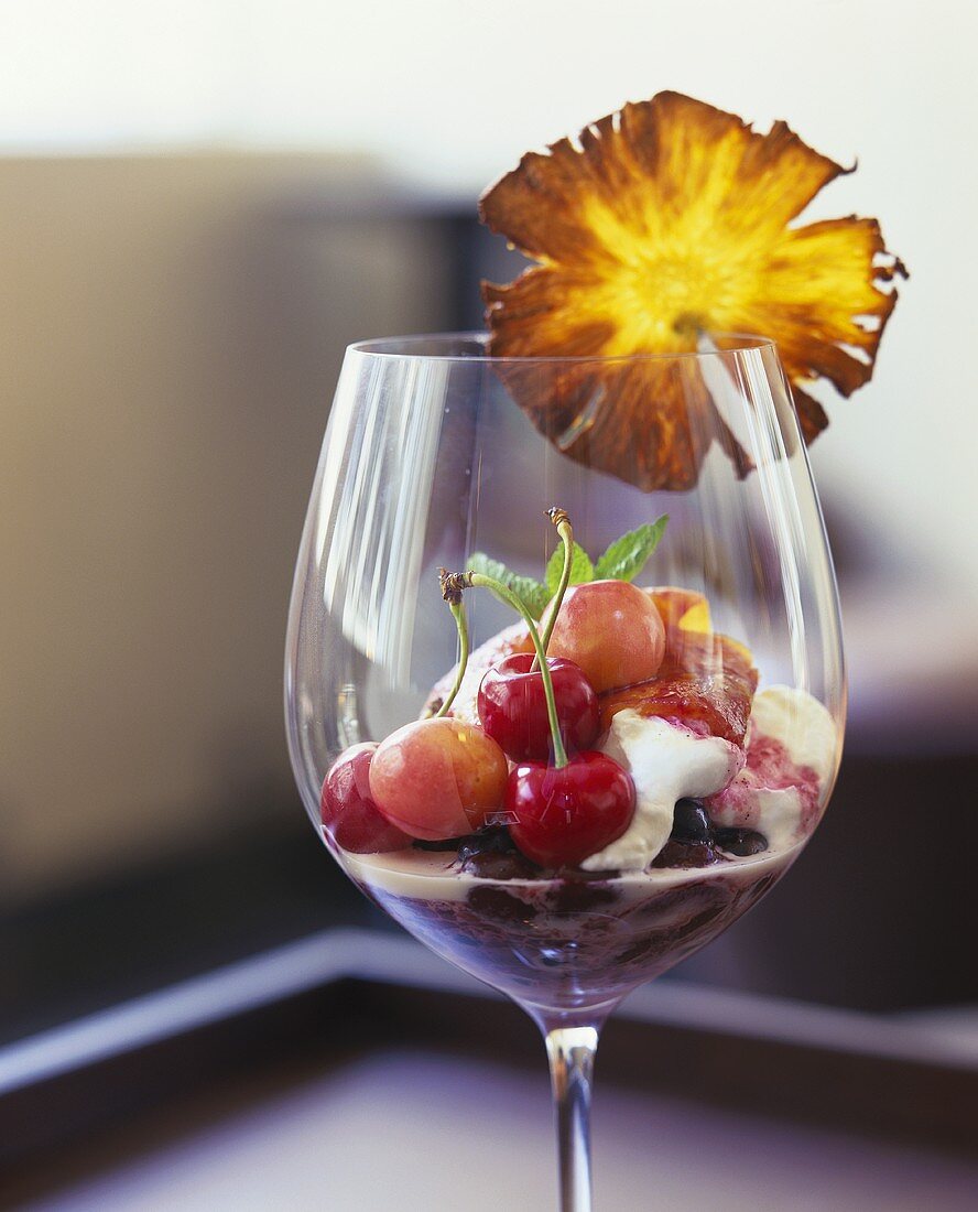 Cherry dessert with vanilla ice cream and blueberries