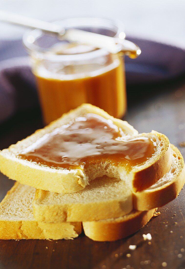 Slice of white bread with maple syrup