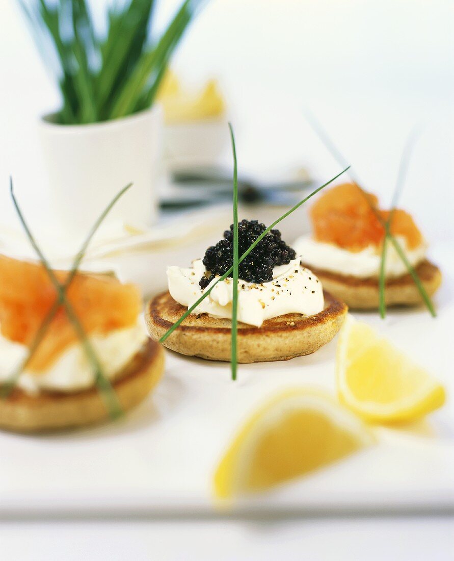 Blinis with sour cream, salmon and caviar