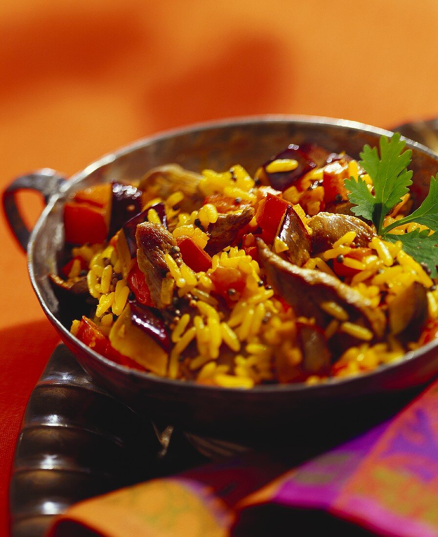 Lamb with curried rice in wok