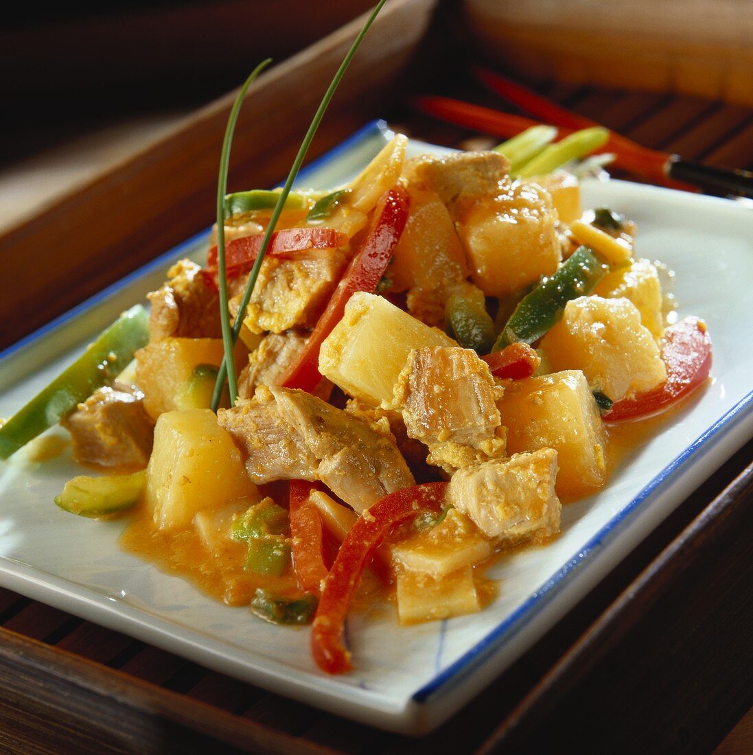 Sweet and sour pork with pineapple and strips of pepper