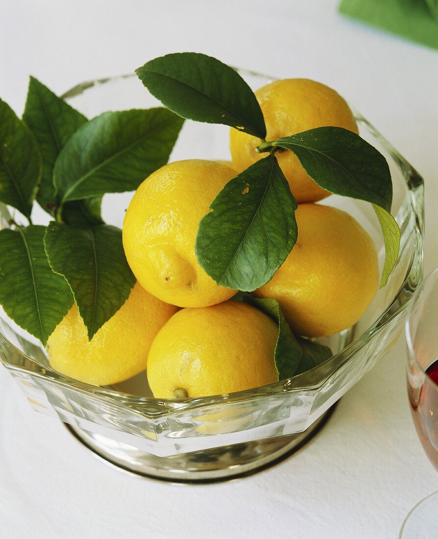 Lemons with leaves in a bowl