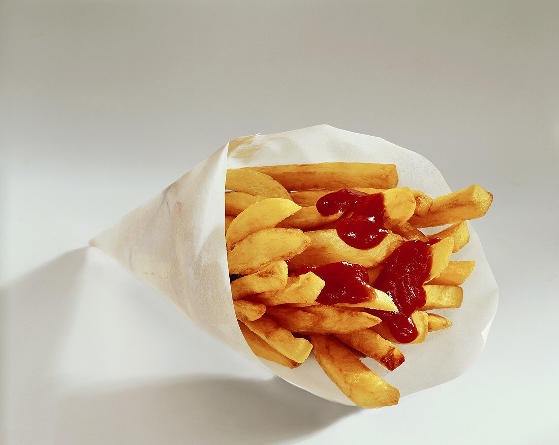 Chips with ketchup in paper bag