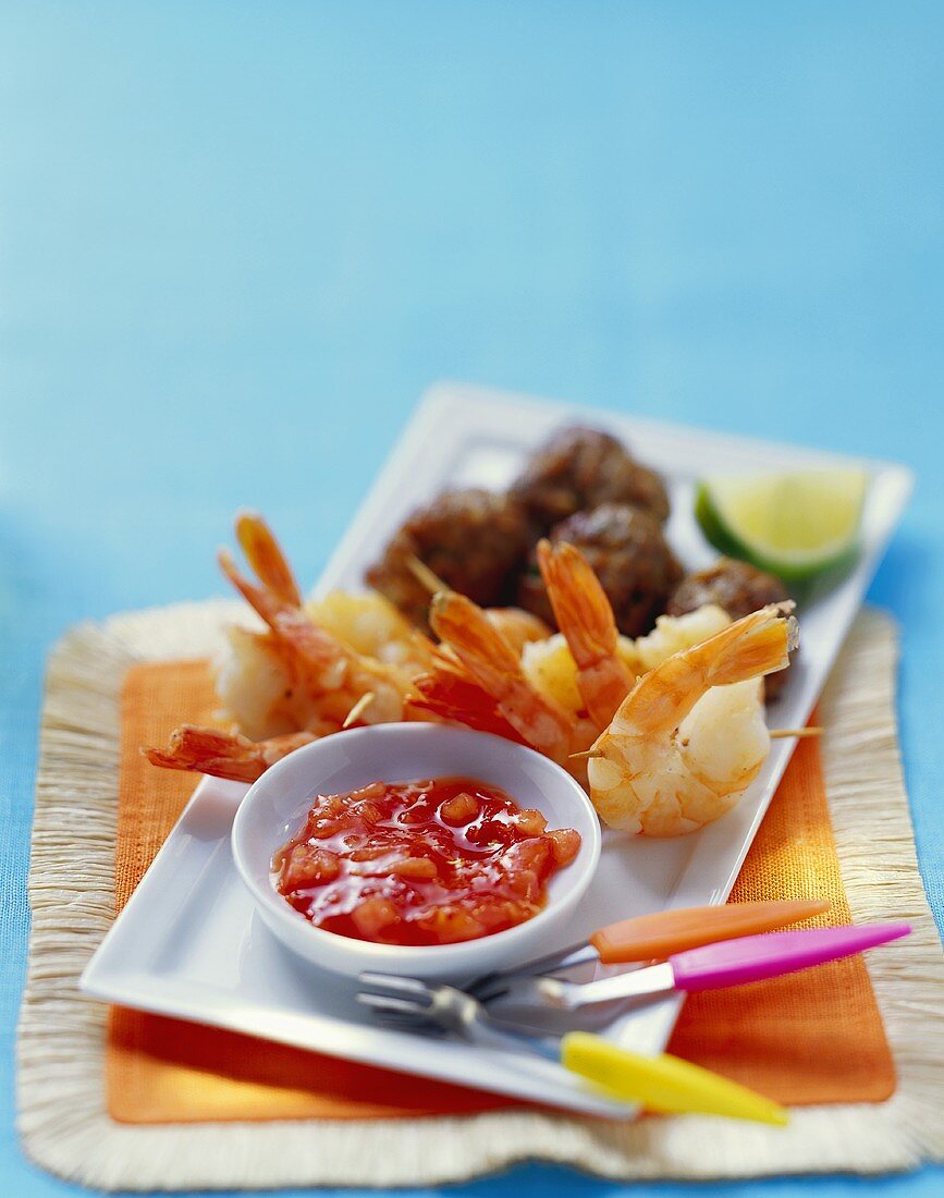 Tomato salsa with shrimp kebabs and meatballs