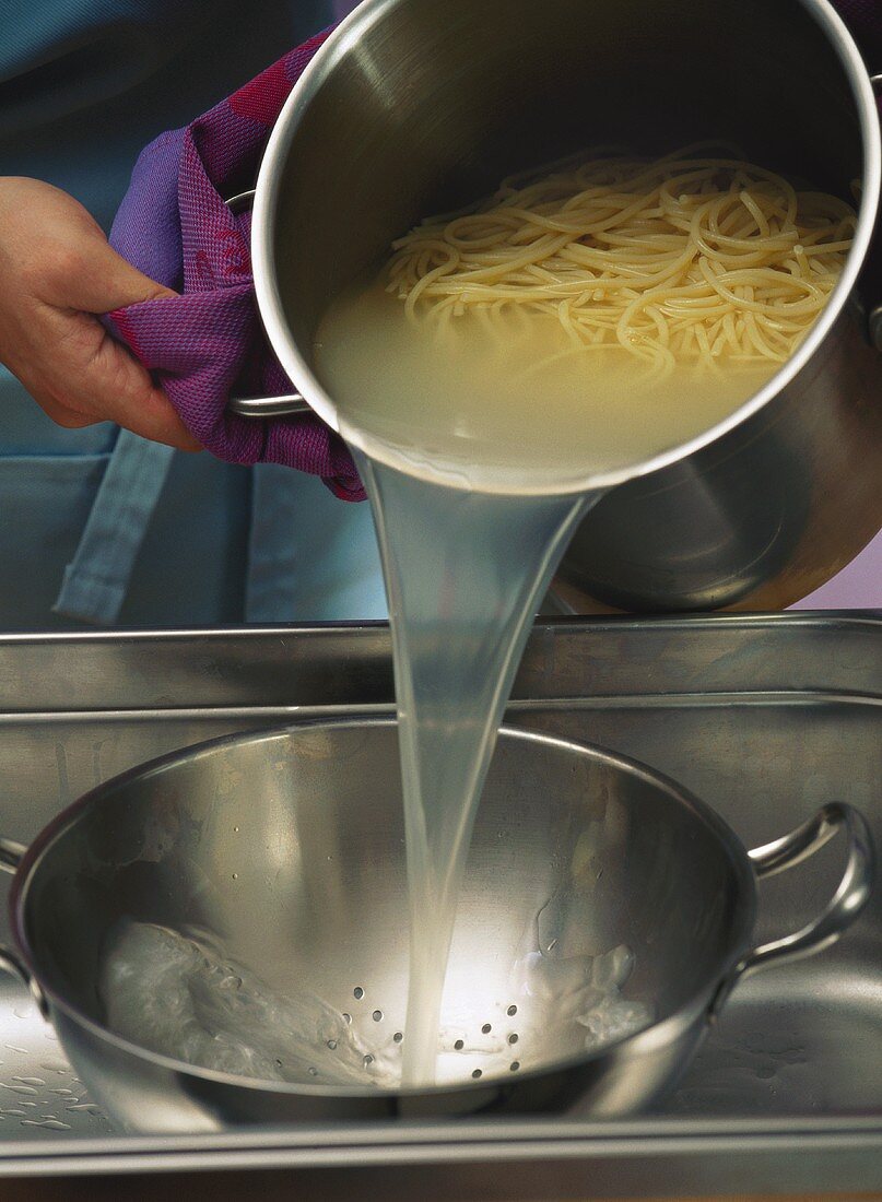 Draining cooked spaghetti