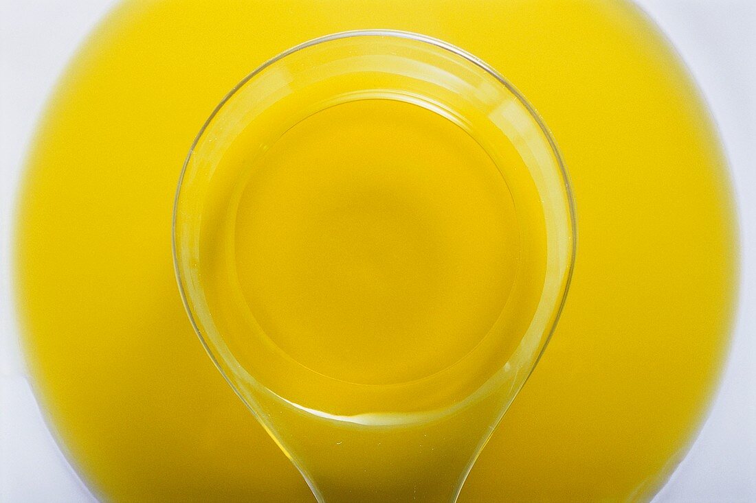 Vegetable oil with plastic spoon