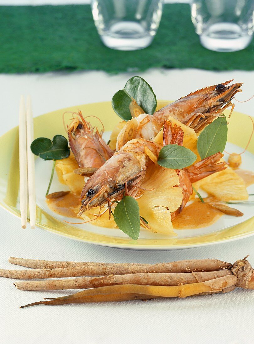 Gambas with pineapple with red Thai curry sauce and krachai
