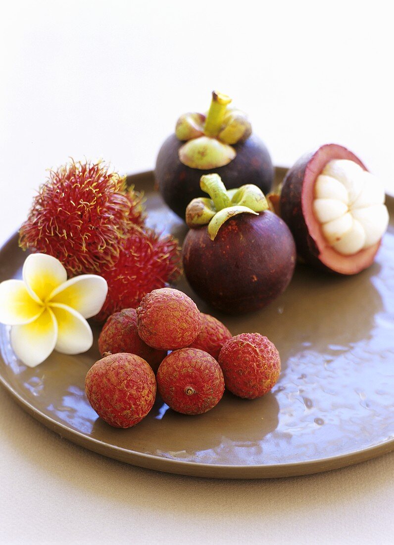 Still life with lychees, rambutans and mangosteens