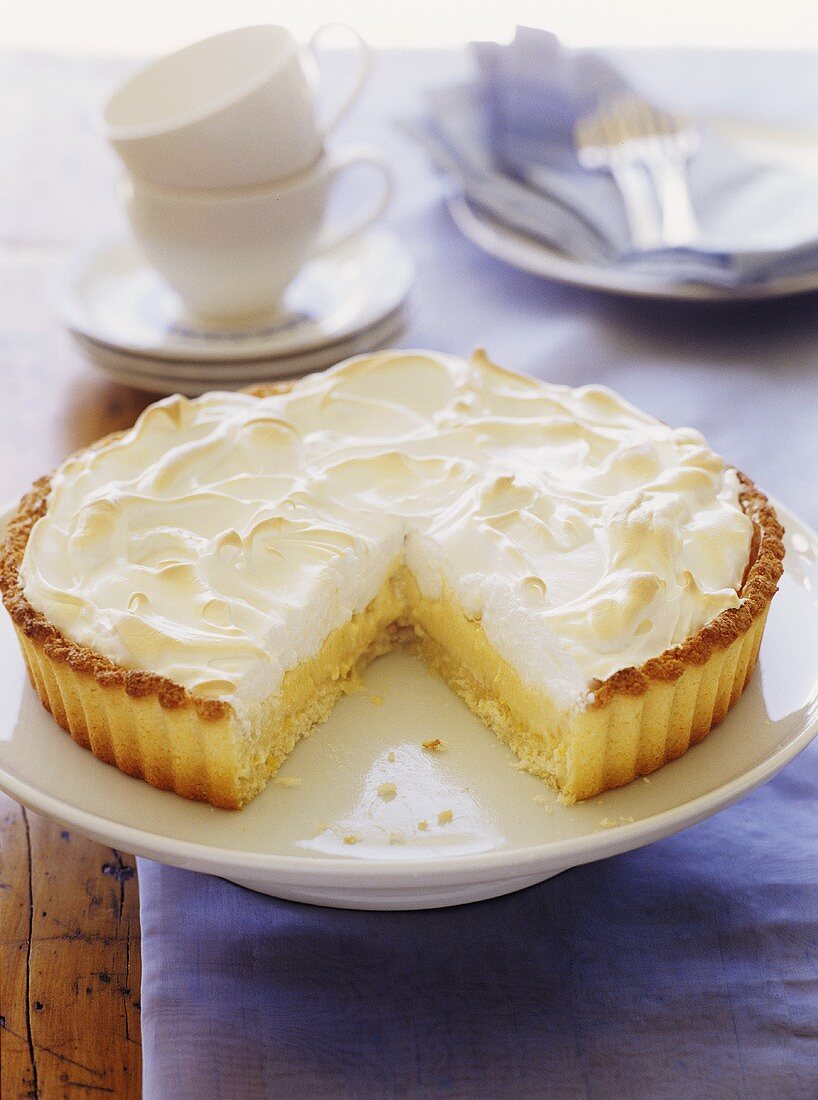 Lemon meringue tart, a piece cut