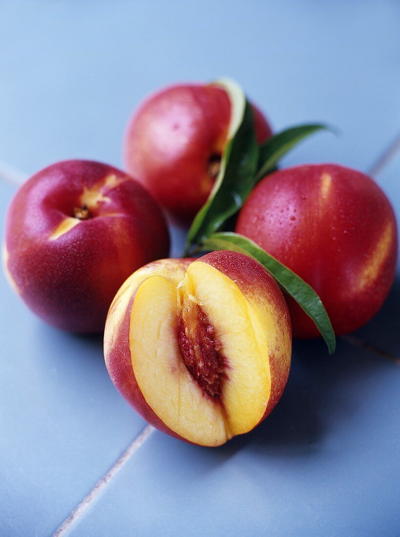 Nectarines, one with a piece cut off