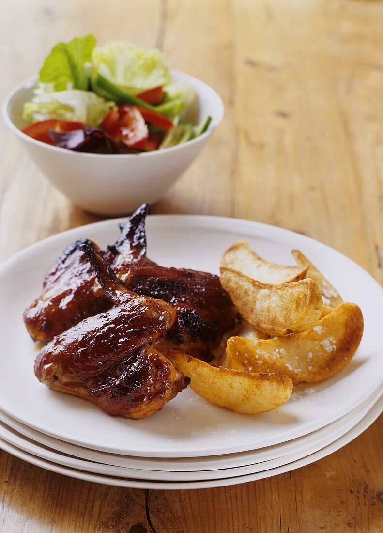 Chicken wings with potato wedges