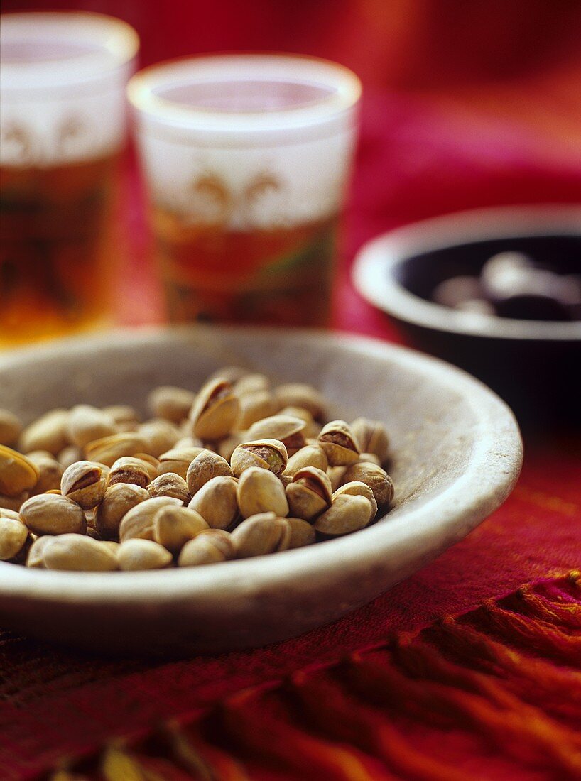 Bowl of pistachios in Middle Eastern setting