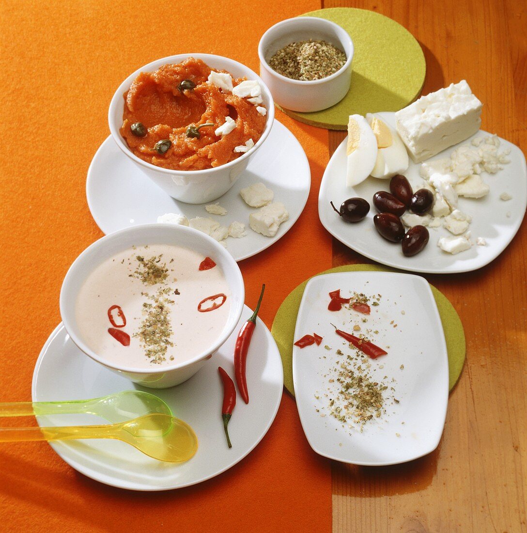Yoghurt dip with chili pepper and carrot dip with capers