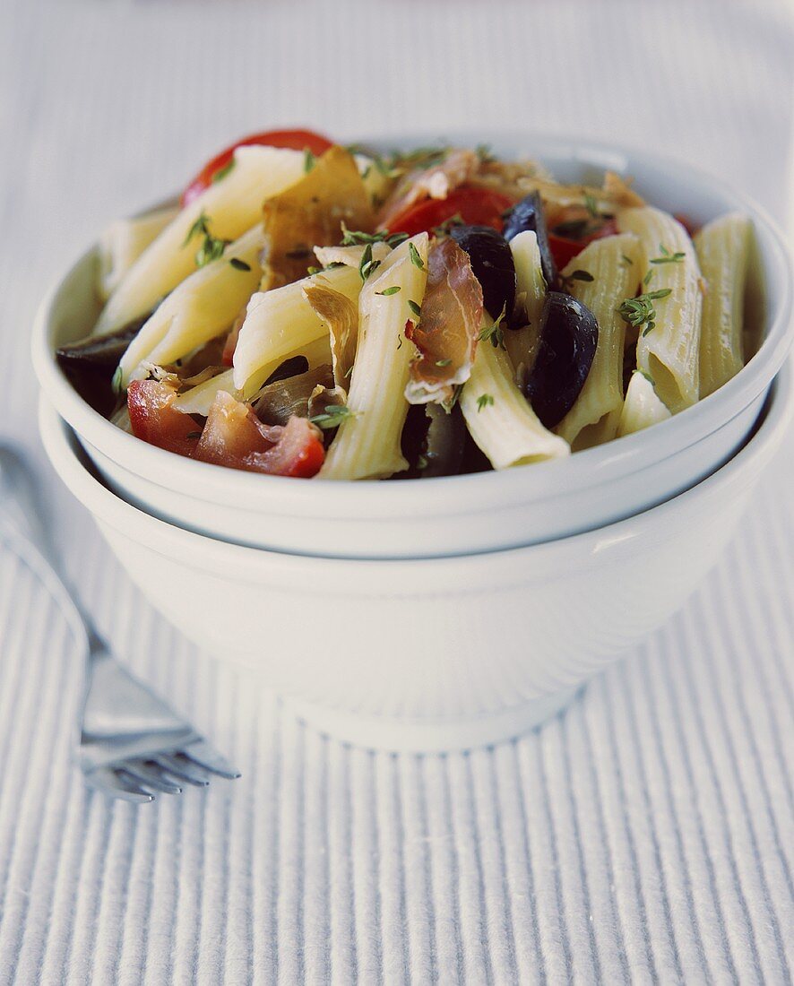 Penne with prosciutto and olives