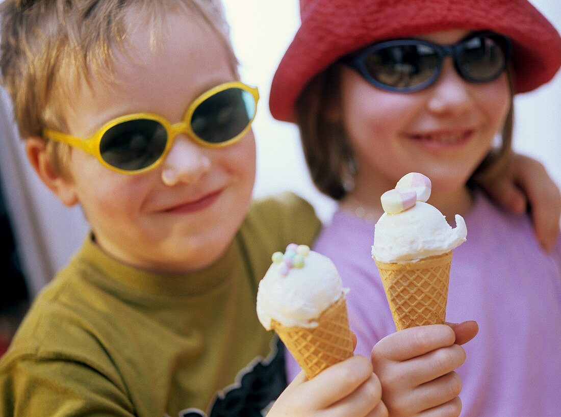 A girl and a boy with ice cream cones