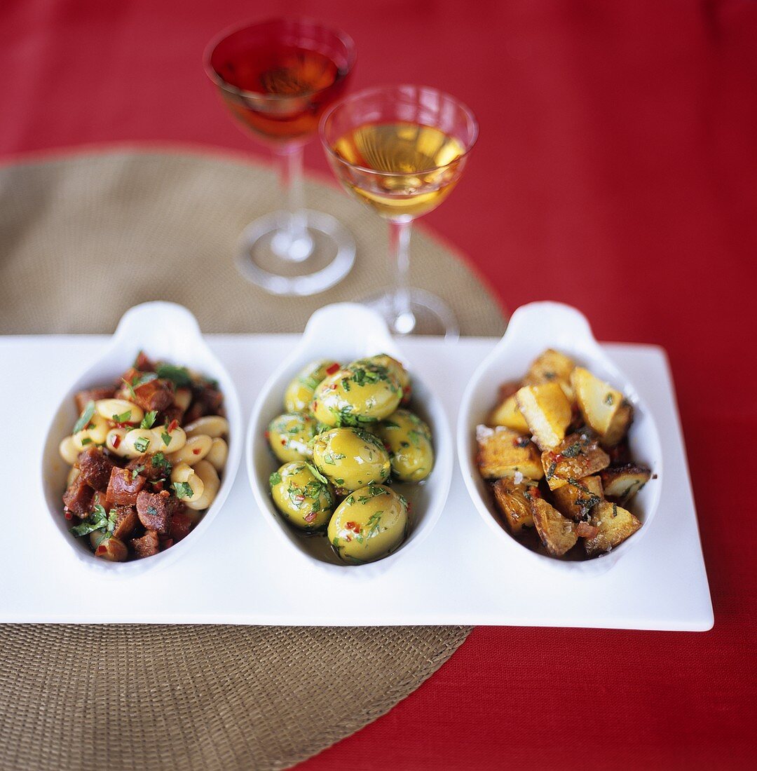 Tapas tableau: beans with chorizo, olives & fried potatoes