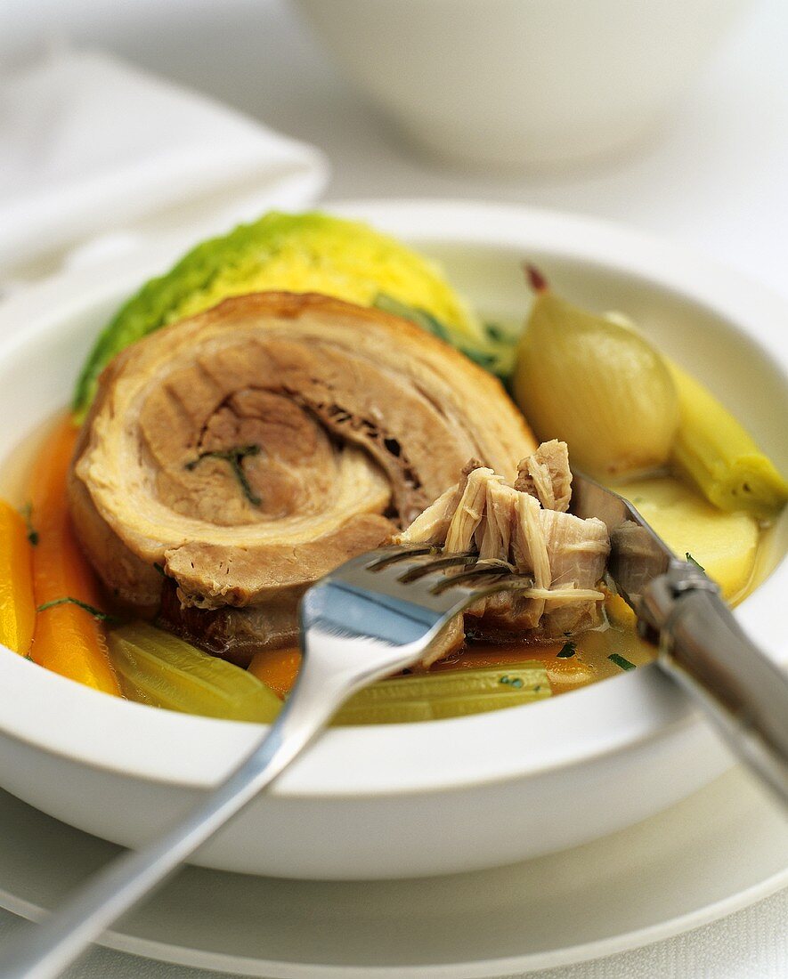 Rolled pork roast with vegetables