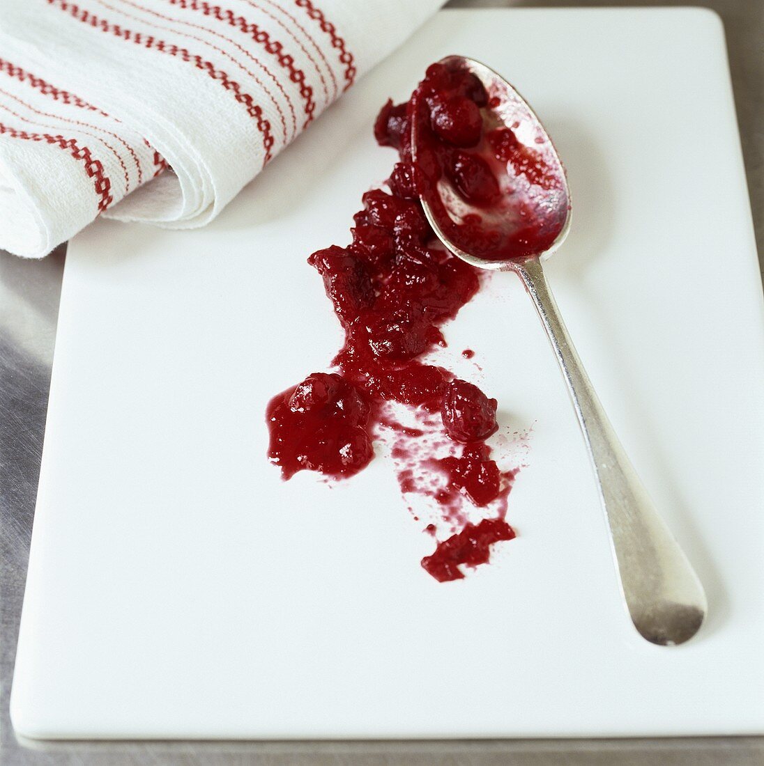 Cranberry sauce with spoon