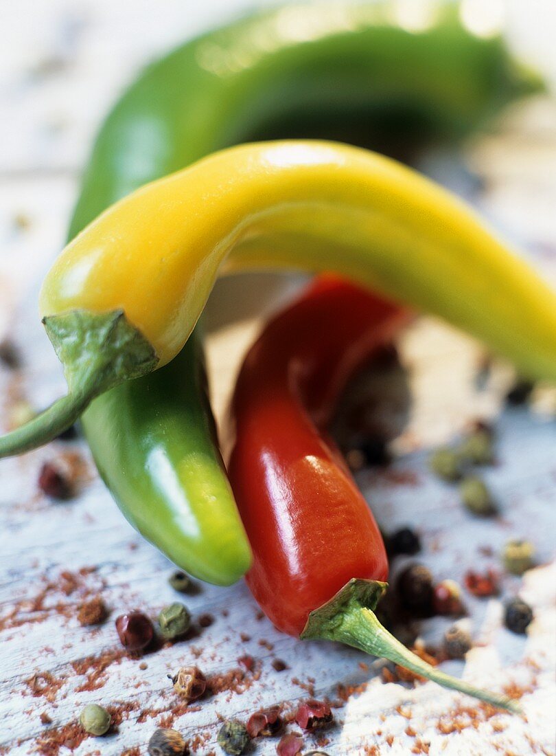 Three chili peppers (yellow, green and red)