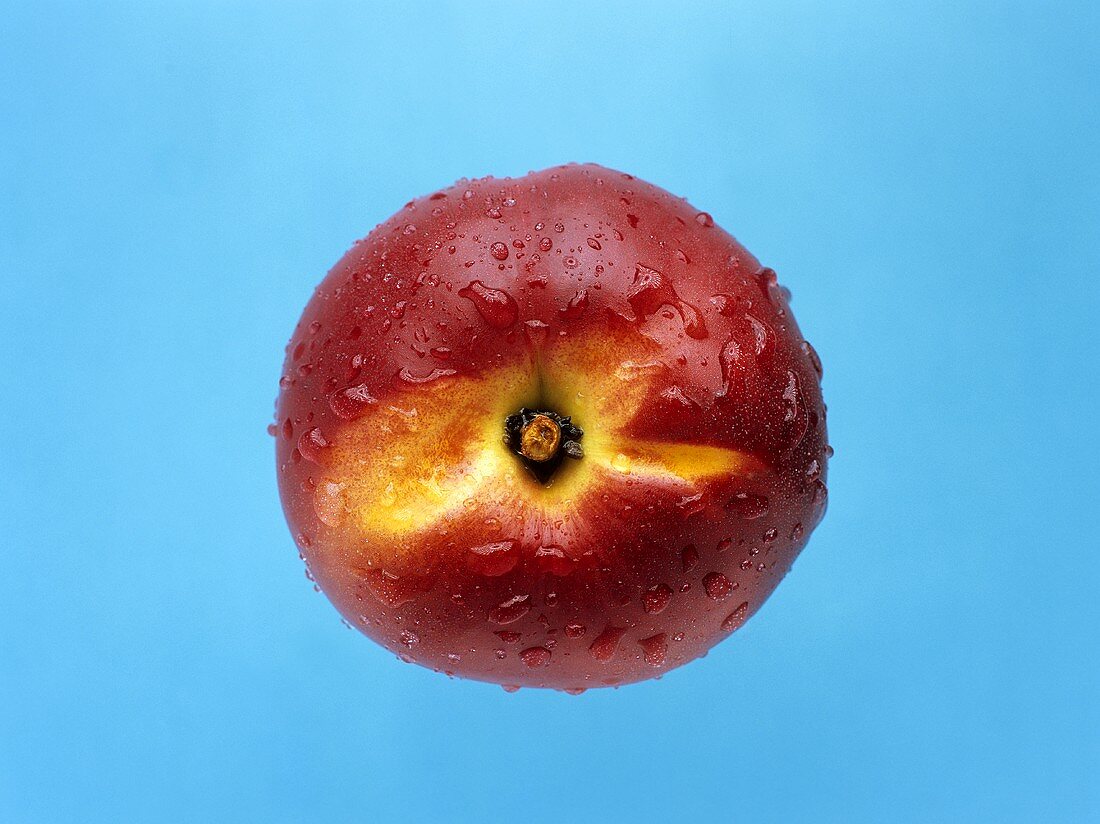 A red apple with drops of water