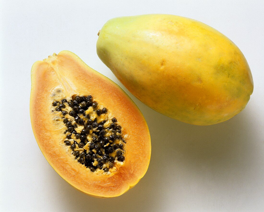 Half and whole papaya