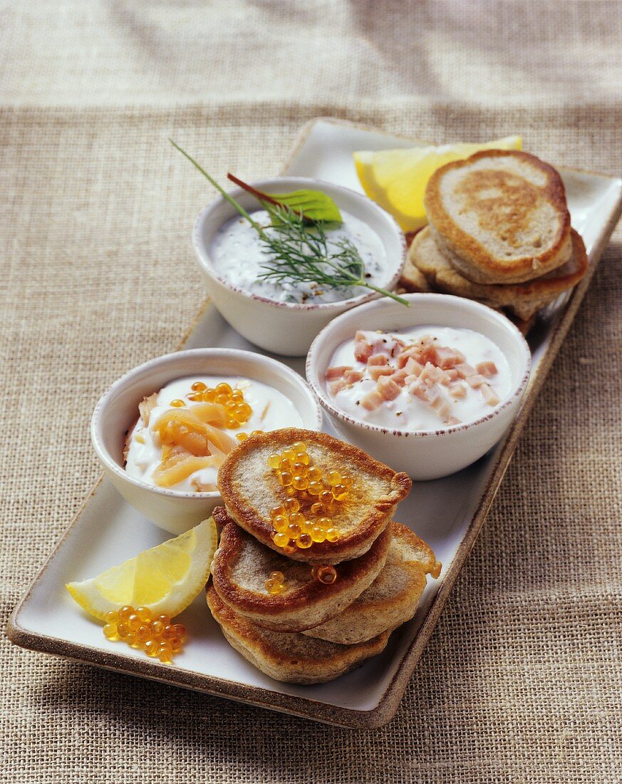 Blinis with caviare and yoghurt dips