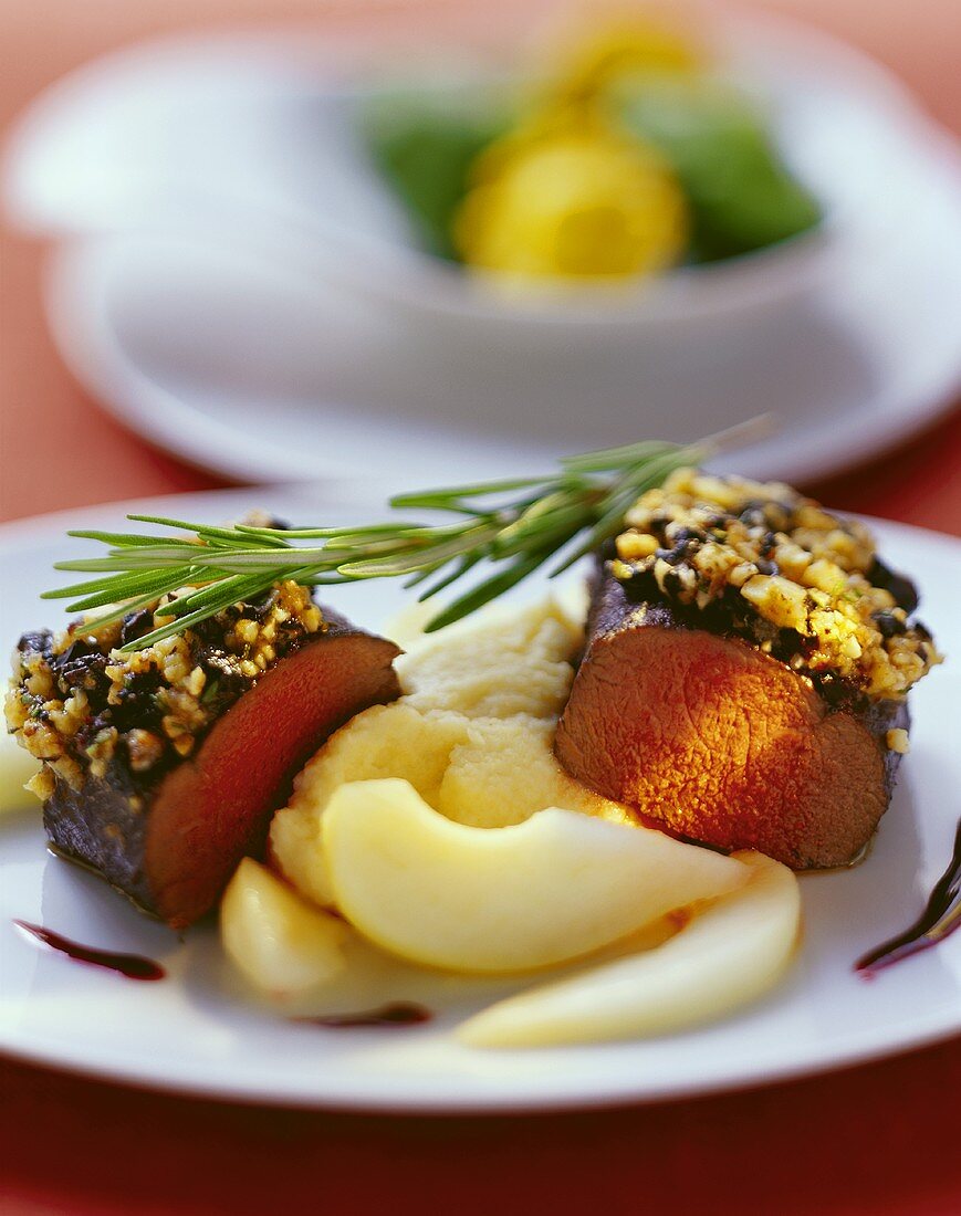 Venison with gratin topping and pears