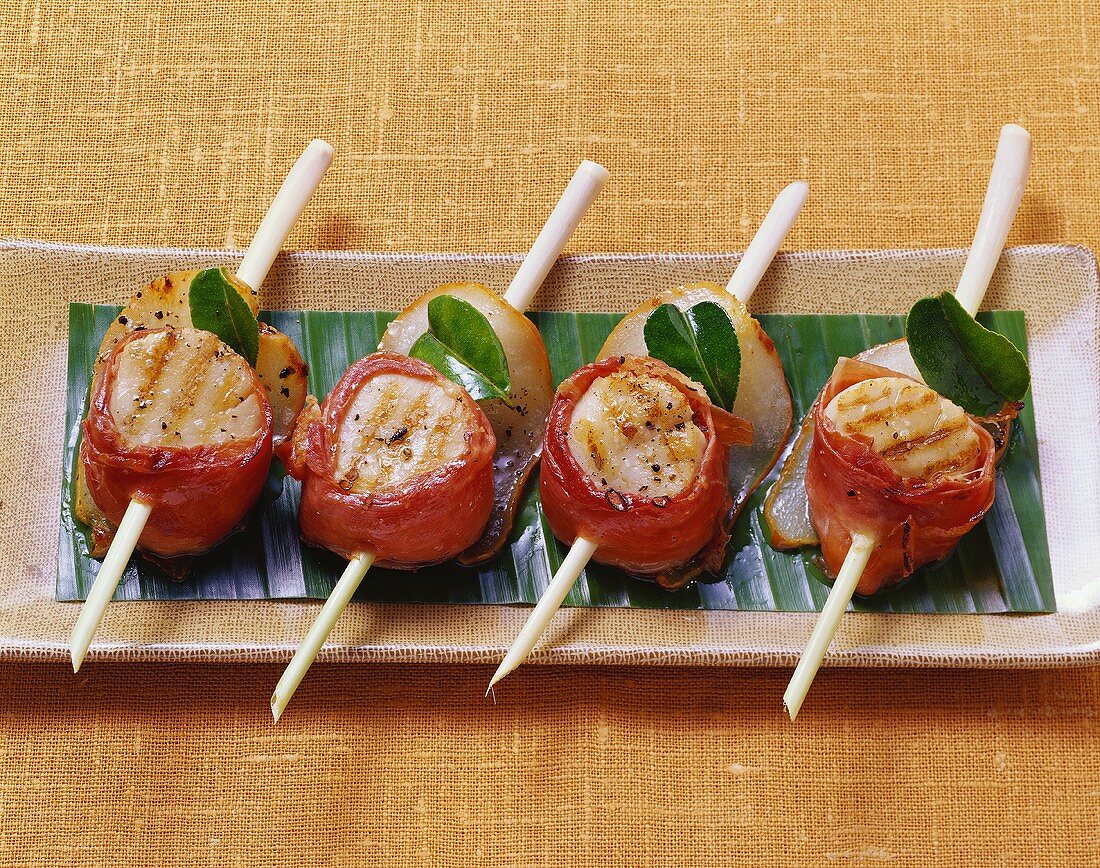 Barbecued scallops skewered on lemon grass