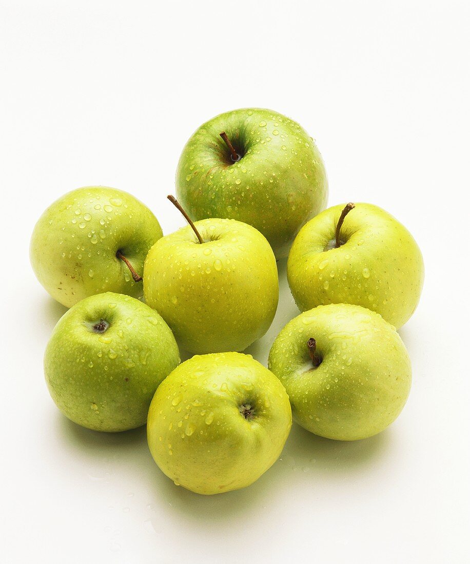 Granny Smith apples with drops of water