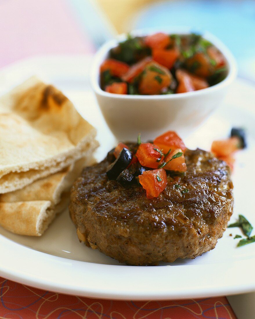 Rissoles with tomato salsa and naan (Indian flatbread)