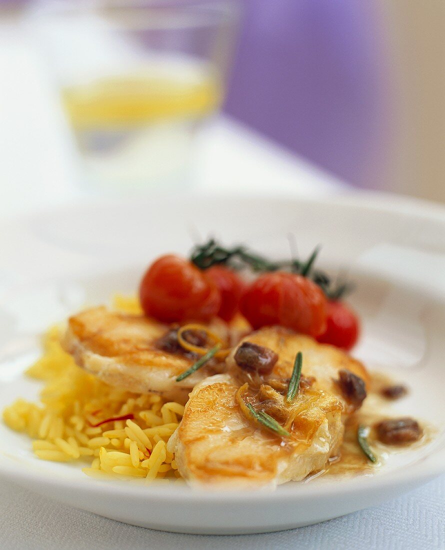 Monkfish with tomatoes, anchovy sauce and saffron rice