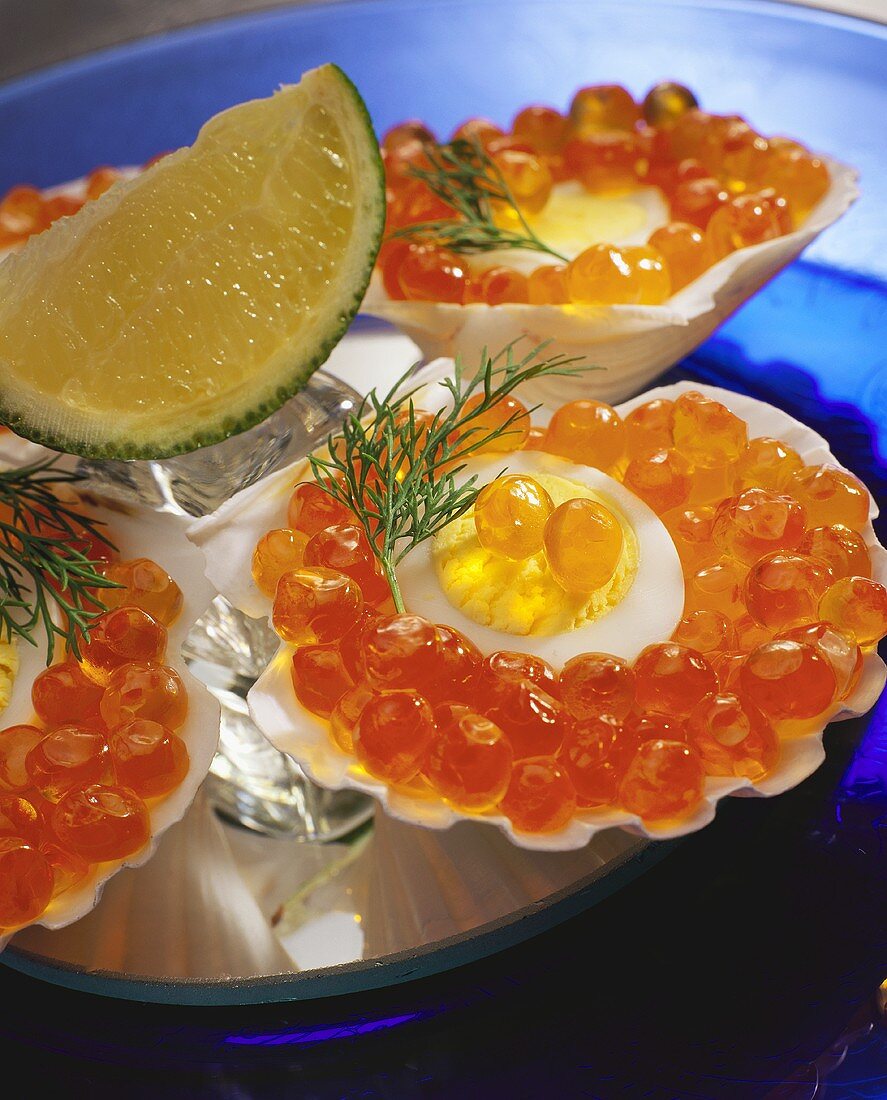 Scallop shell with egg and salmon caviare