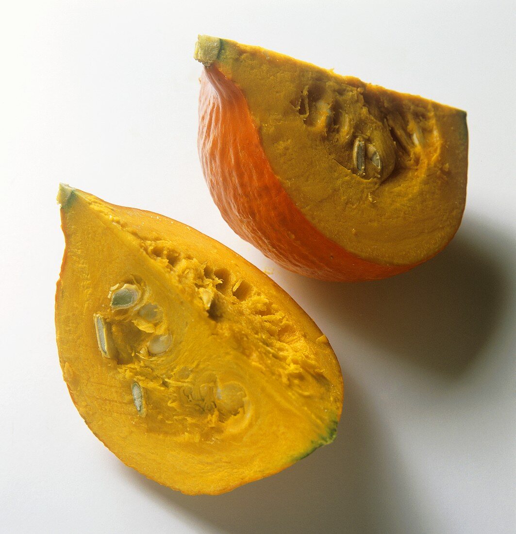 Two pumpkin wedges (variety: Hokkaido)